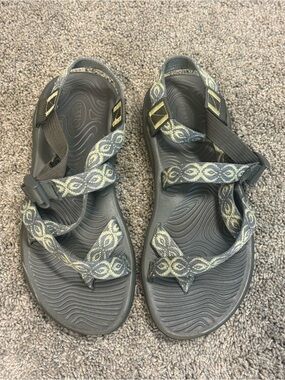Chaco gray sandals with yellow patterned webbing
